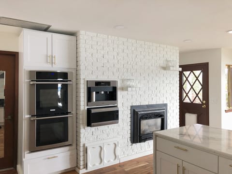Double oven and automatic espresso machine in the kitchen