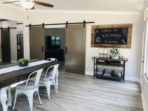 Dining room leads into family room thru barn doors.