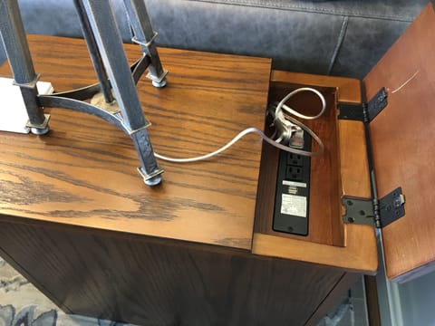 The 2 end tables in the family room have built in plugs for electric and USB