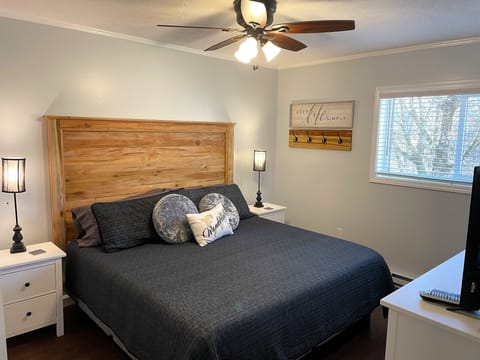 Master bedroom with king memory foam mattress and custom maple headboard.