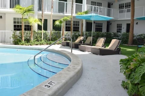 A heated pool, sun loungers