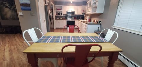 Dining table with leaf and bench (not shown) comfortably seats 4 to 8 people.