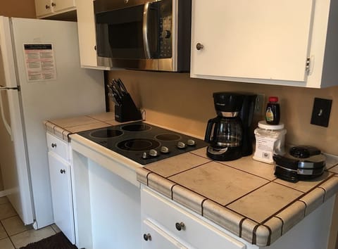 Fridge, microwave, stovetop, coffee/tea maker