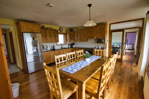 Kitchen with dining table seating 8