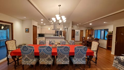 With the oak table in the background the dining room seats 18 people.