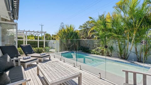 A heated pool, sun loungers