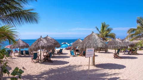 On the beach, sun loungers, beach towels