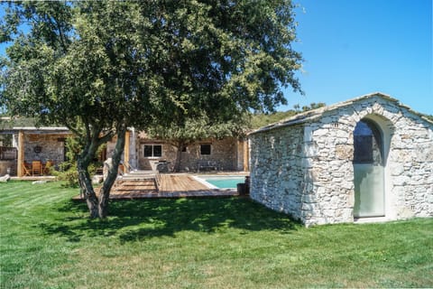 A heated pool, sun loungers