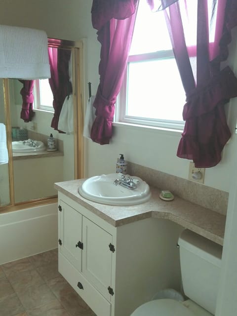 Full bathroom: has tub/shower combo with fluffy towels, hair products, body wash