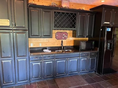 Downstairs kitchen with wet bar, additional fridge/freezer with ice maker and plenty of storage space