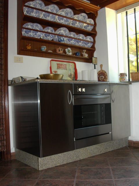 Fridge, oven, coffee/tea maker, cookware/dishes/utensils