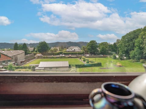 View over bowling green towards the Lake district hills | The Stable Loft - The Stables Apartments, Bowness on Windermere