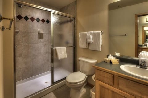 Bathroom area with nice tile shower.