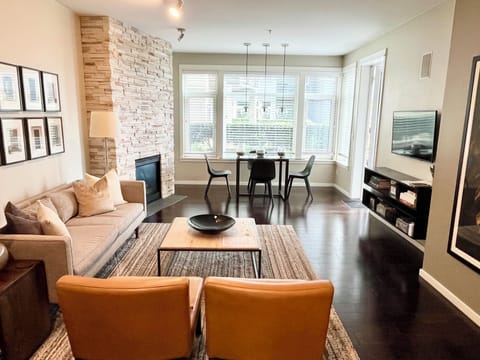 Open living space w/ high ceilings and oversize windows.