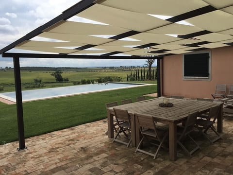 fully equipped patio for eating outside and modern barbecue.