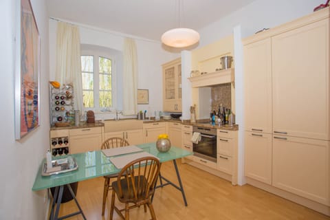 Eat-in kitchen with all  cookware, dishes and appliances with a view to the moat