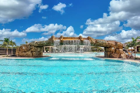 This waterfall resort pool gives vacation VIBES!
