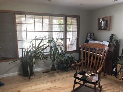 Living room with piano.
