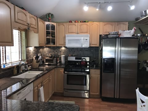 Kitchen with Gas Stove and Stainless Steel Refrigerator
