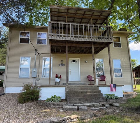 Front of house.  Deck off the master bedroom.