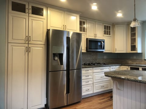 Kitchen with Stainless Appliances, Cook top, roll out Pantry Drawers 