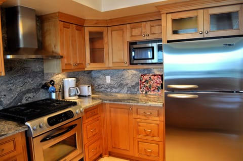 Kitchen with stainless steel appliances equipped with everyday needs