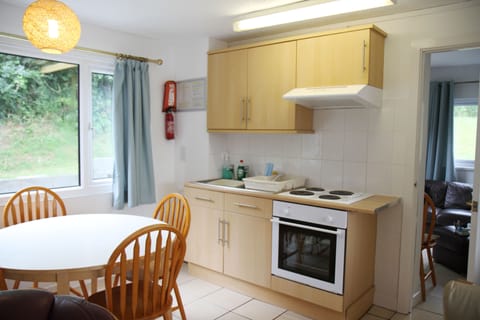 view of the kitchen and entrance to the ground floor bedroom