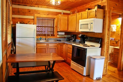 Kitchen complete with dishes, cookware, and appliances. Just bring the food!