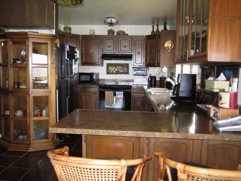 A fully stocked kitchen, with a window overlooking the water as well!