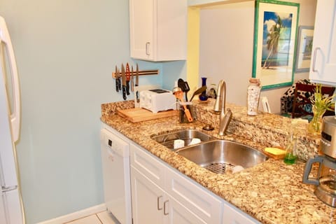 Granite kitchen stocked with spices, utensils, pots/pans coffee, tea, dishwasher