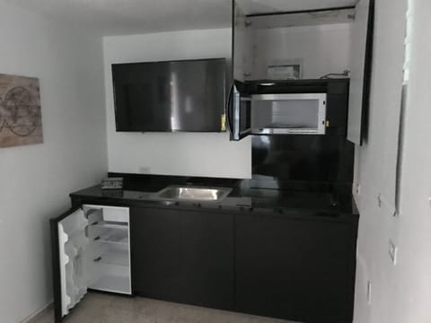 Fridge, microwave, stovetop, coffee/tea maker