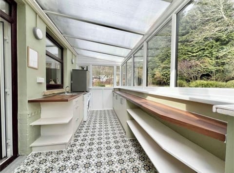 Large utility with washer, dryer, extra fridge, plastic glasses for hot tub etc