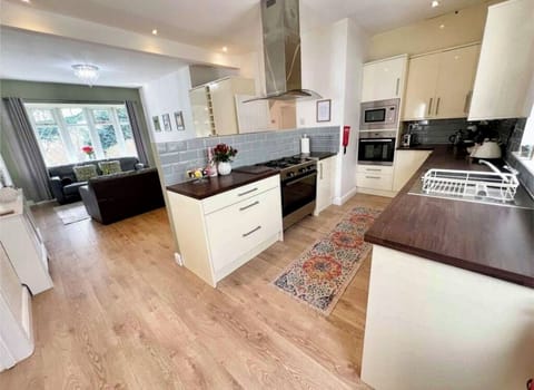 Large open plan kitchen, cosy area for entertaining and catching up with friends