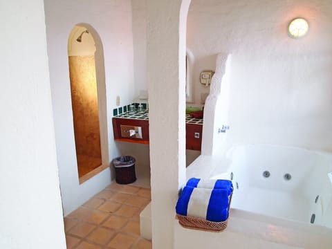 Jetted tub, hair dryer, towels, toilet paper