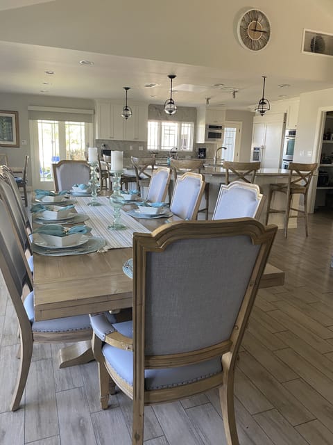 Dining room right outside the kitchen, includes leaf for seating up to 10 people