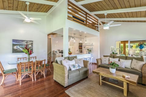 Entertain in style with this open-plan space blending living, dining, and island flair.