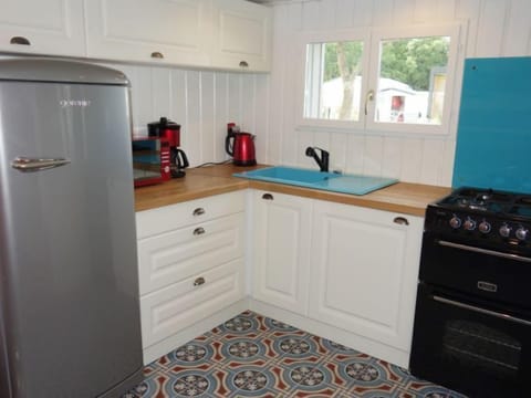 Fridge, oven, highchair, cookware/dishes/utensils