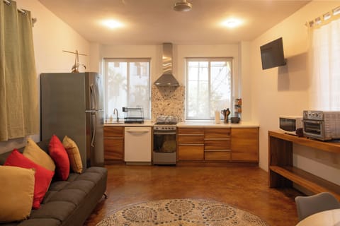 The kitchen and living room areas.