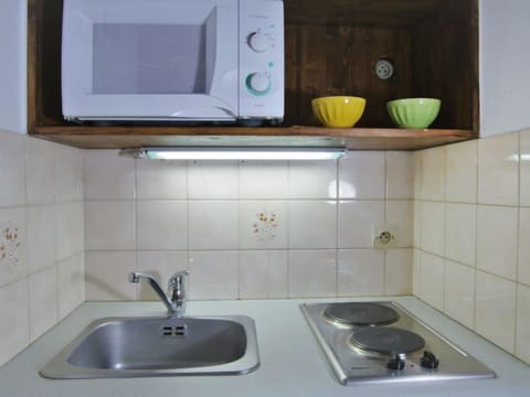 Fridge, microwave, cookware/dishes/utensils