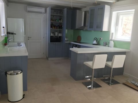 The kitchen is well stocked with crockery, glassware and utensils