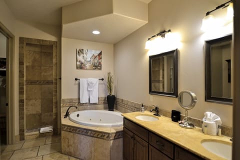 Master bathroom with jacuzzi and walk in shower. 