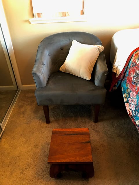 A cozy chair to sit in an watch your favorite show with a foot rest  for comfort