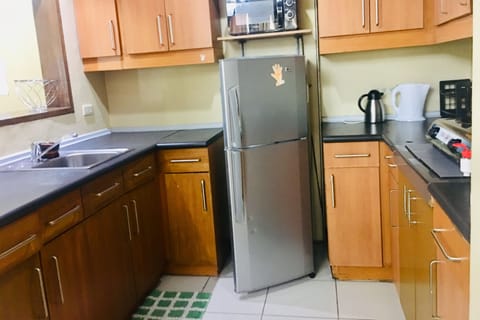 Fridge, microwave, stovetop, cookware/dishes/utensils