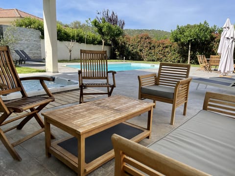 A heated pool, sun loungers