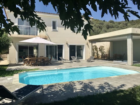 A heated pool, sun loungers