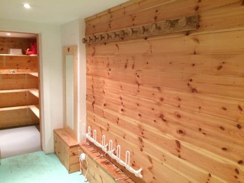 Ski Room with heated boot racks and hooks