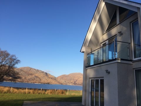The house with Loch Ailort and the hills in the background.