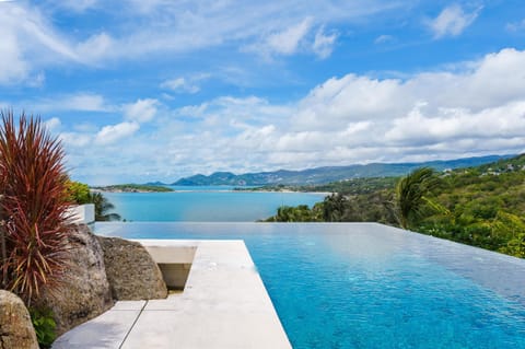 An infinity pool, sun loungers