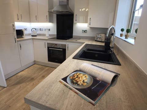 Extremely well equipped kitchen with cooking utensils, baking trays, crockery, cups/glasses. Plastic cutlery and bowls/plates for children. Large fridge/freezer. Brand new Bosch appliances (oven, washing machine dishwasher, tablets provided)