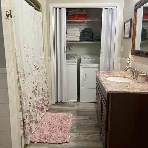 Combined shower/tub, hair dryer, towels, soap